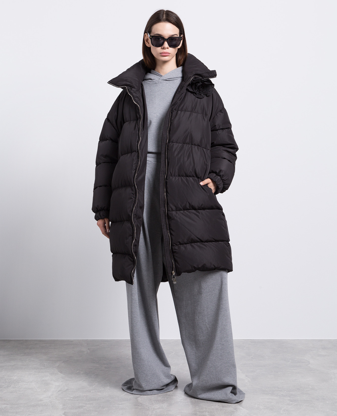 

Black quilted down jacket with a brooch Giuseppe Di Morabito Milano