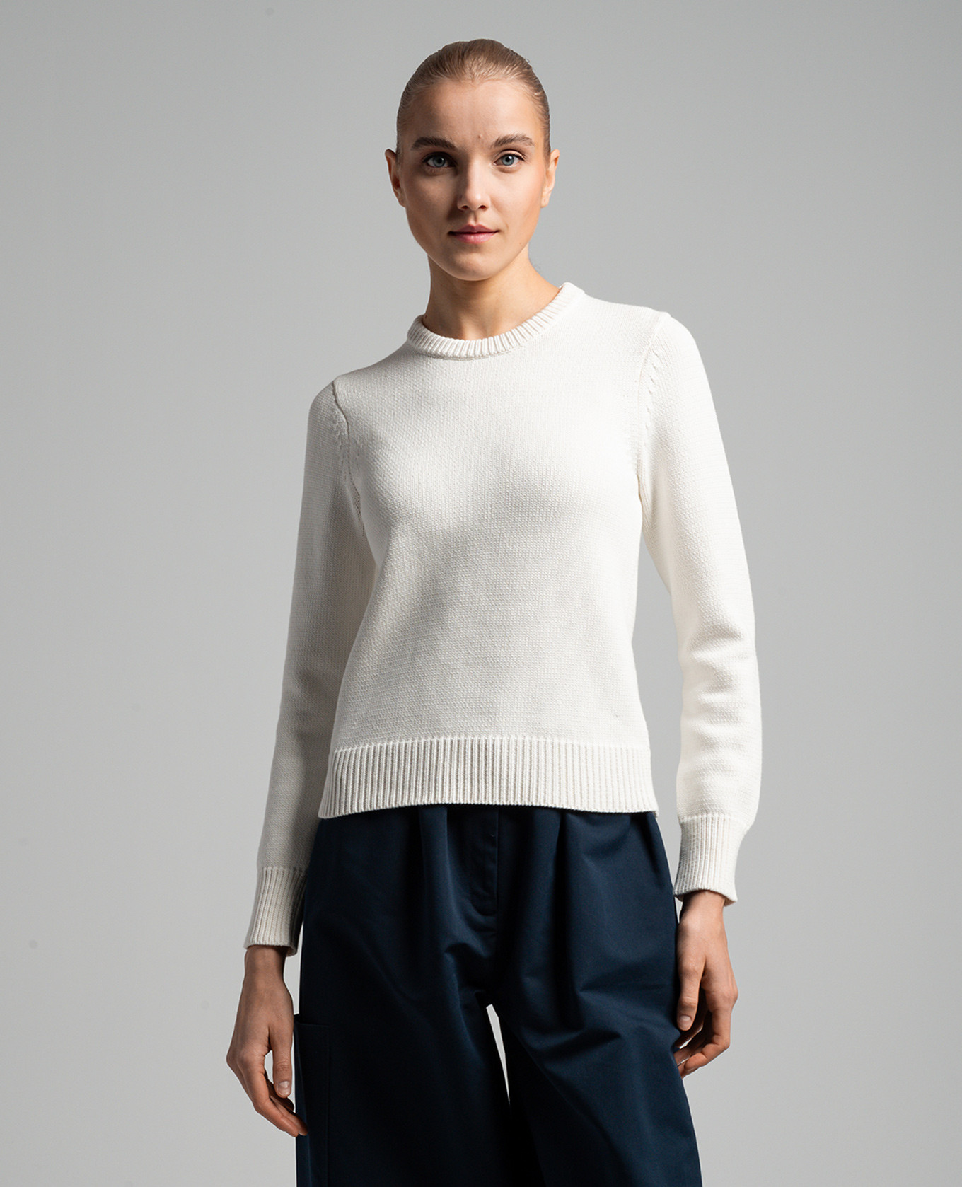 

White sweater with a scar CO