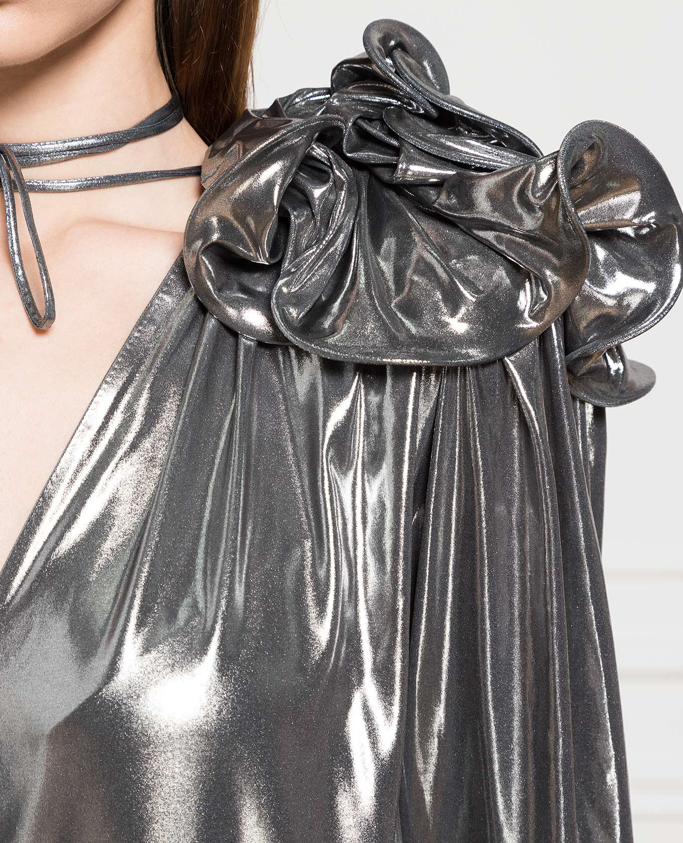 

Silver blouse with a brooch Magda Butrym