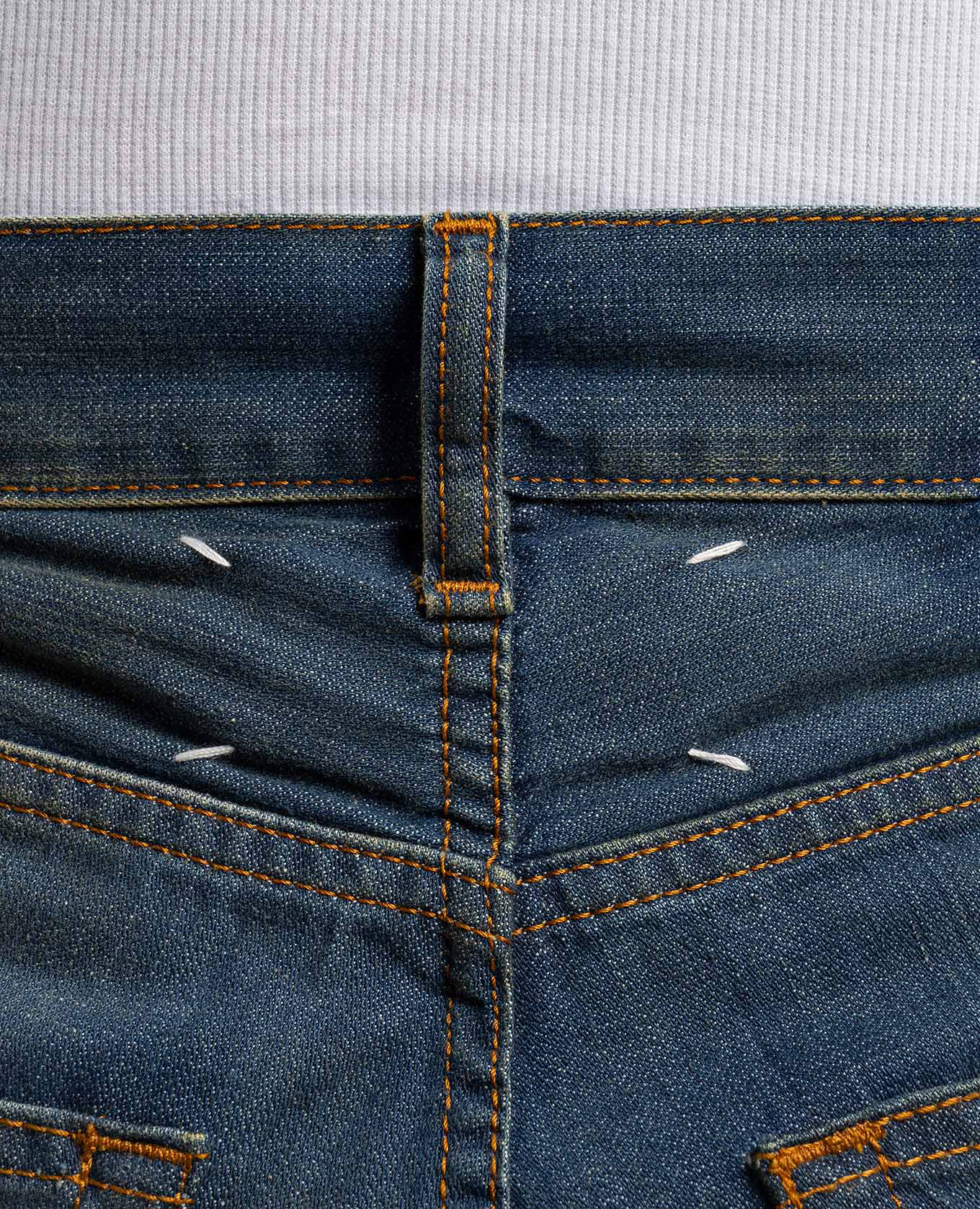 

Blue jeans with a distressed effect Maison Margiela