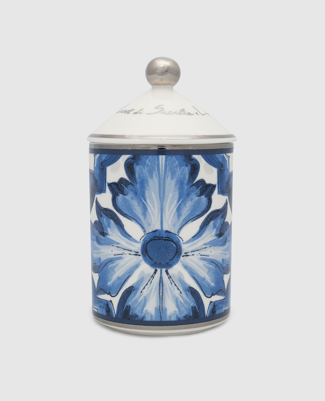 Scented candle with the aroma of neroli and lemon in a porcelain candle holder