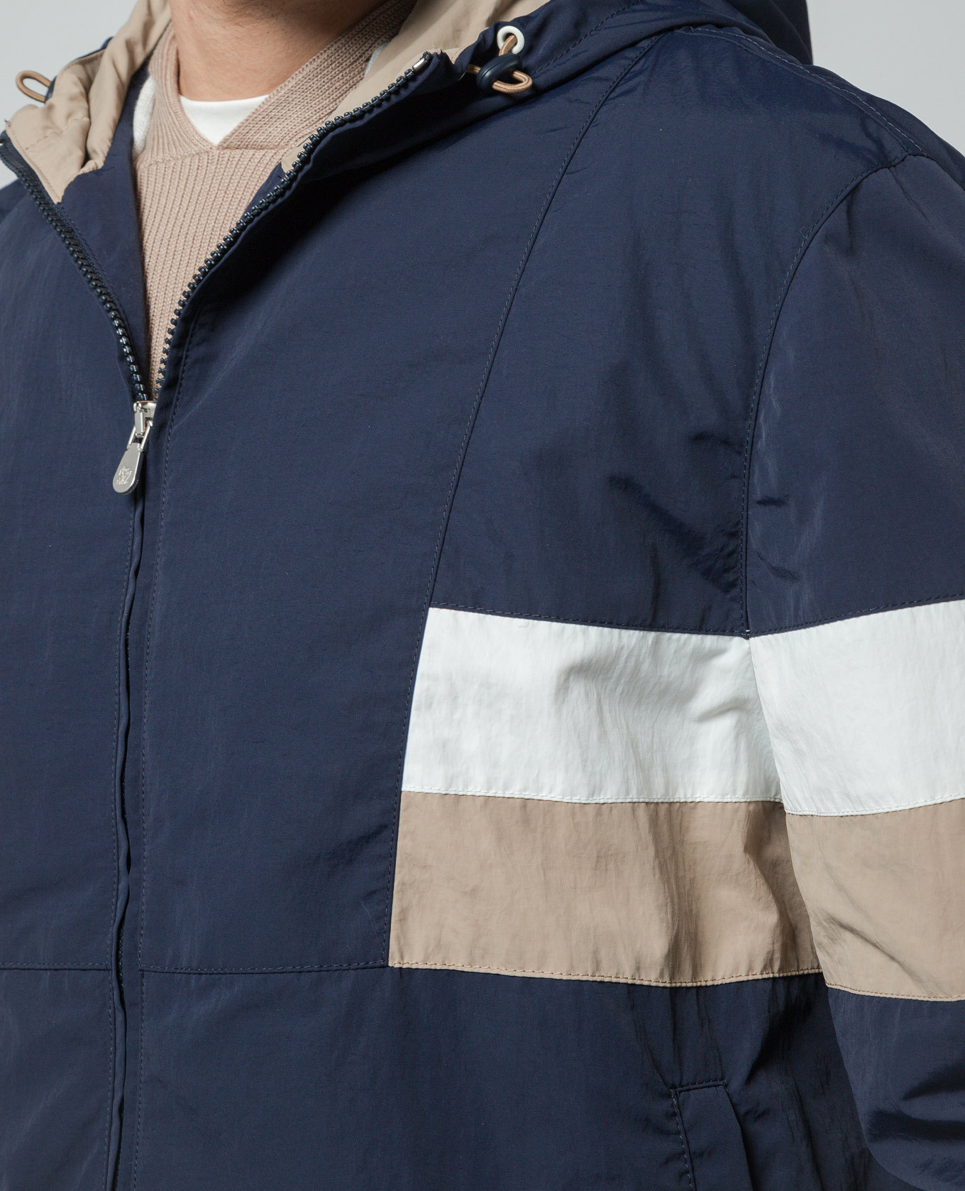 

Blue windbreaker with contrasting inserts Brunello Cucinelli