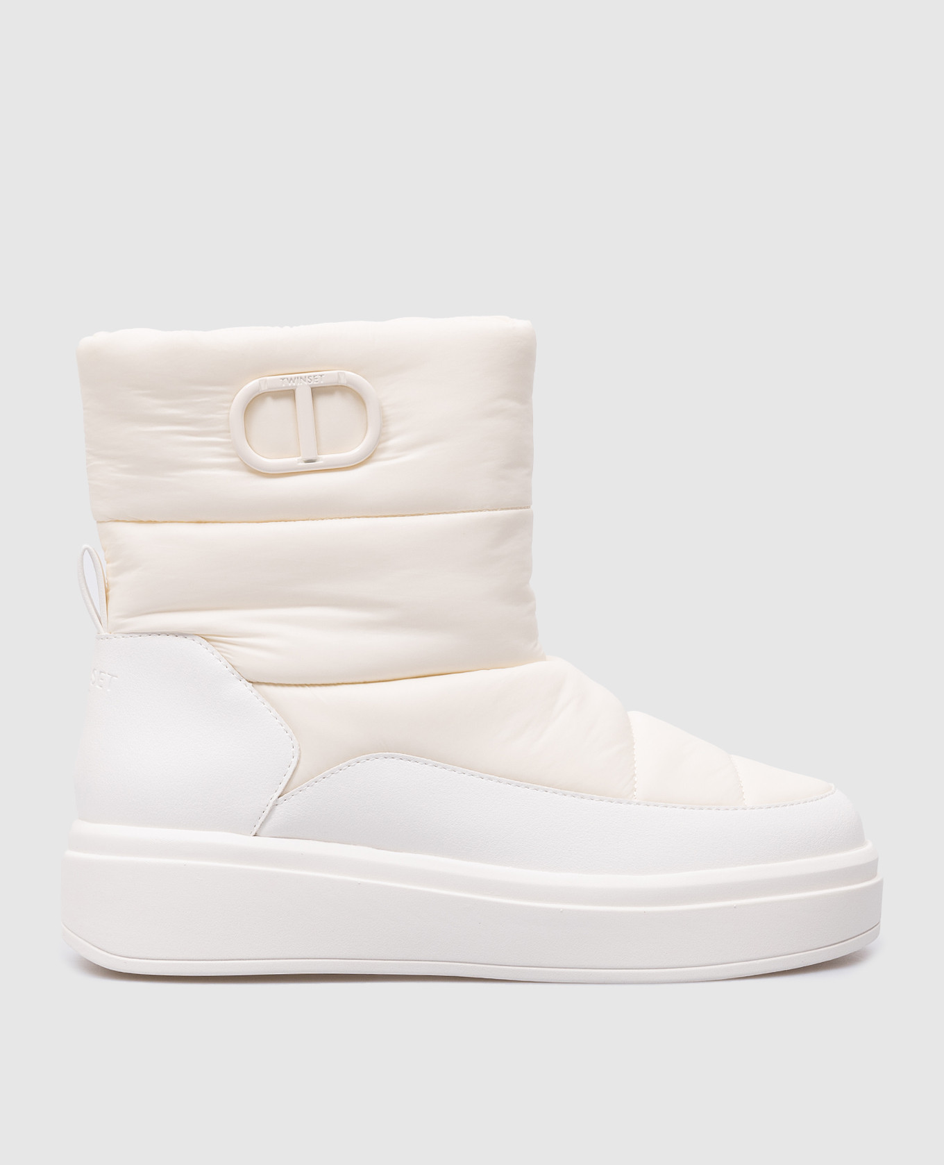 White moonboots with metal oval t logo twinset