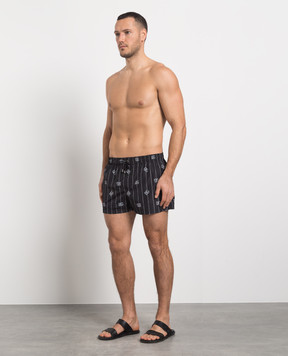 Dolce&Gabbana Black swim shorts with DG logo print M4A06TISMDD