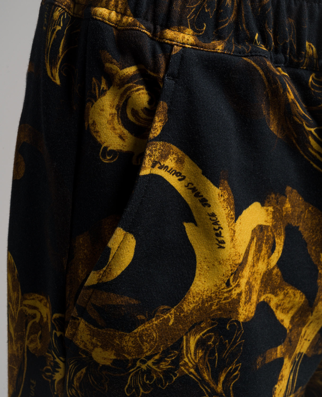 Black pants in Watercolor Couture print Versace Jeans Couture 5