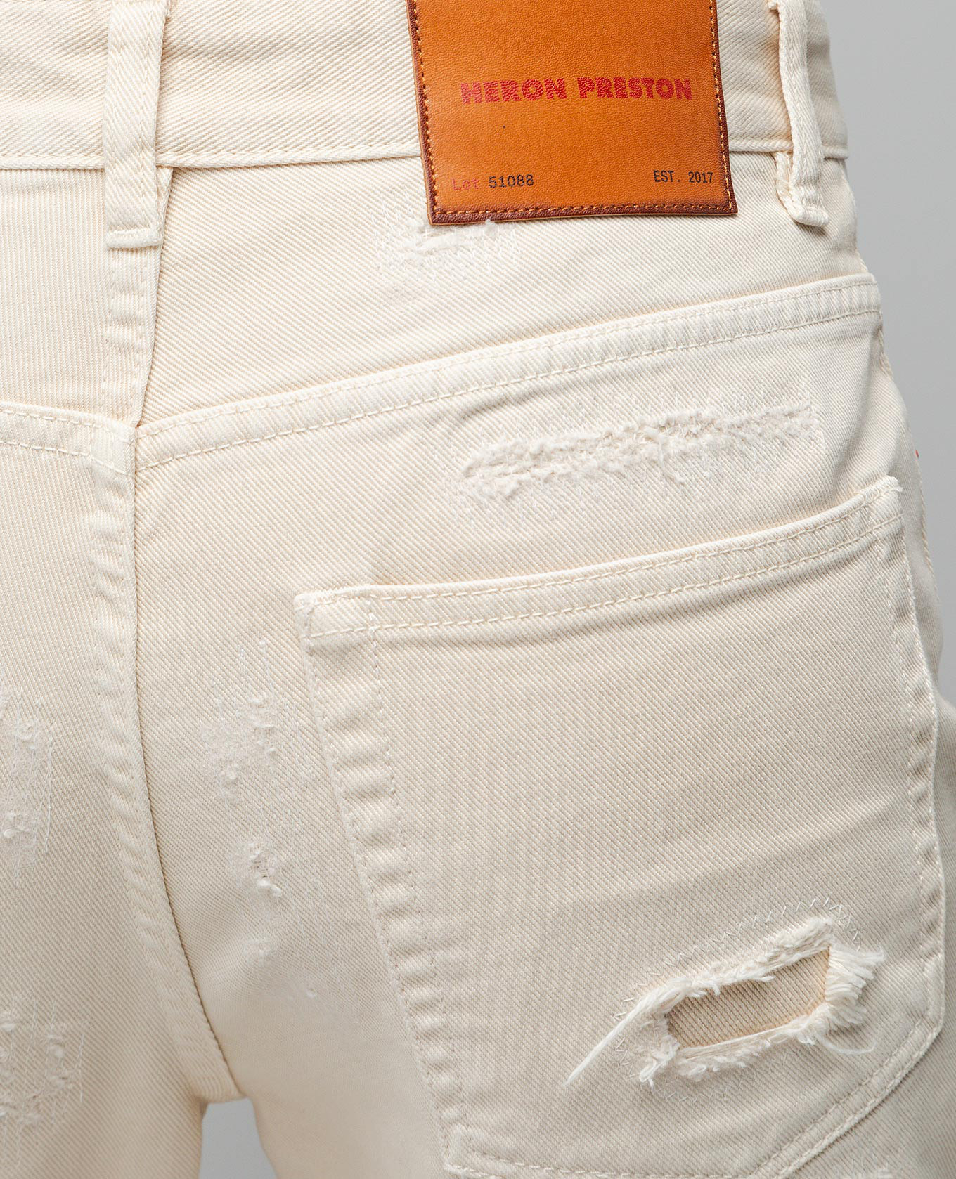 

Beige jeans with holes Heron Preston