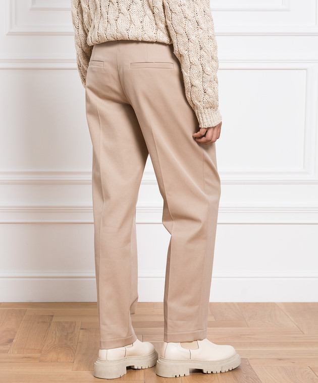 Brunello Cucinelli Pantalón beige con cadena de monil