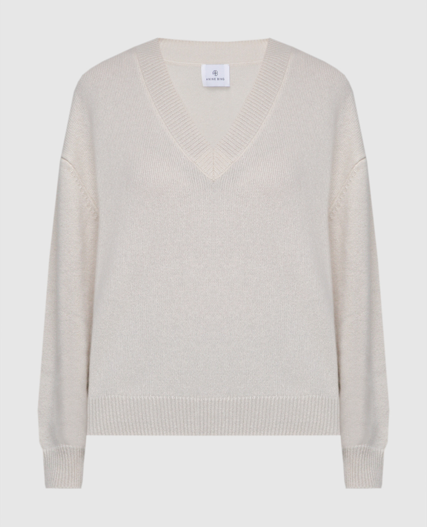 

White cashmere pullover with a free cut Anine Bing