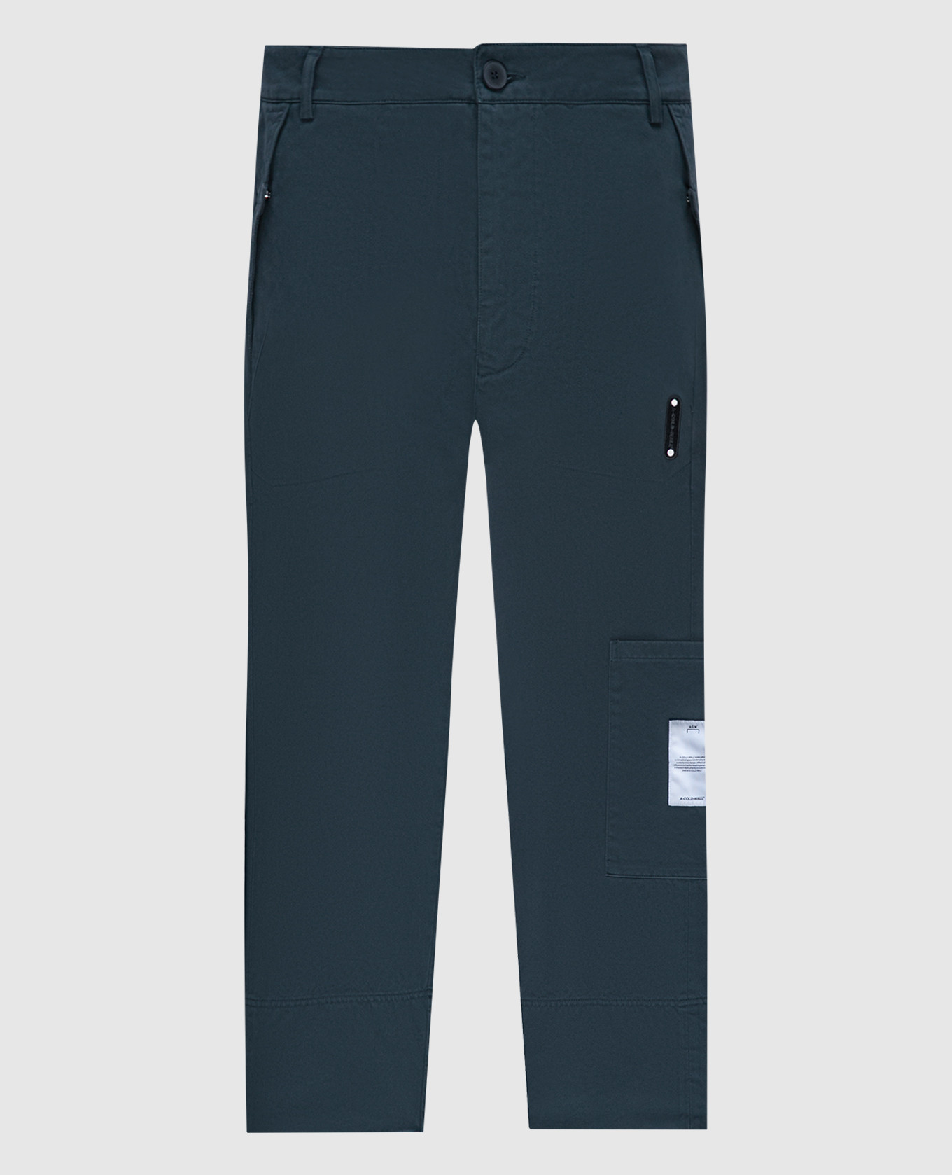 Green pants with logo patch a cold wall